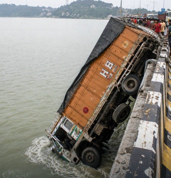 Truck Falls Off Saraighat Bridge After Driver Allegedly Falls Asleep